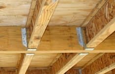 I-Joists in hangers to wood floor beam